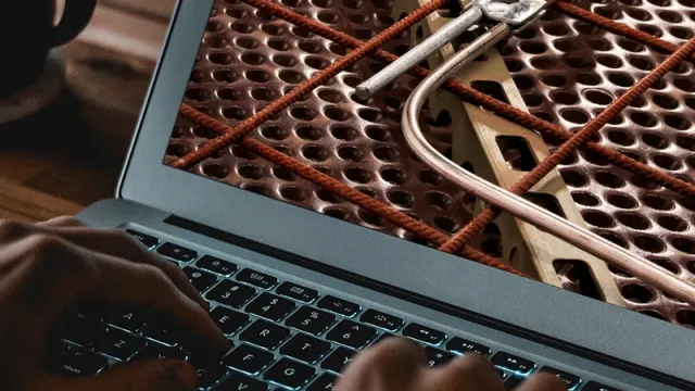 A laptop shows a close-up of an earthing system.