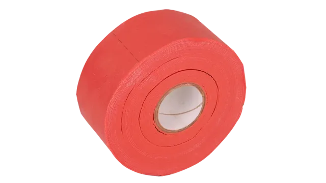 A captivating image displays a bold, vibrant red tape roll as its captivating center. The rough, circular texture adds a rugged charm, set against a striking black background. The tapes off-center position, angling towards the top left, highlights its durability and visual presence.