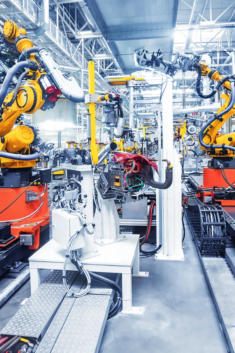 Yellow robots in industrial building